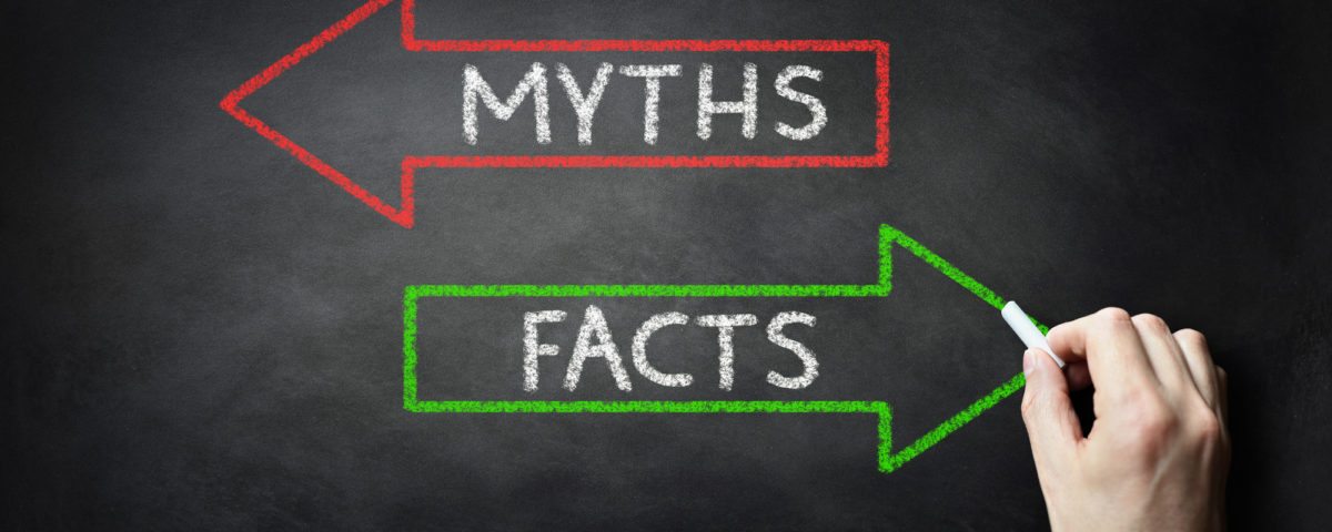 Businessman drawing Myths or Facts on blackboard