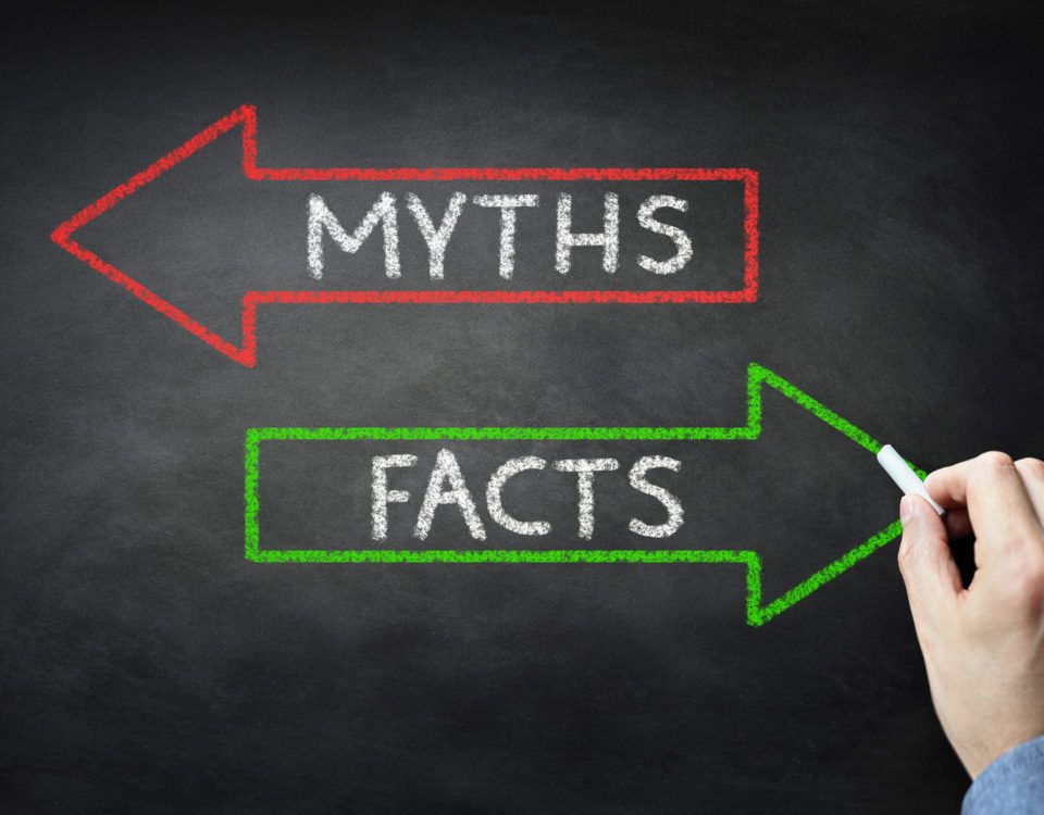 Businessman drawing Myths or Facts on blackboard